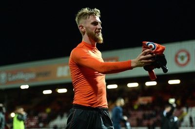 081218 - Brentford v Swansea City - SkyBet Championship - Oliver McBurnie of Swansea City gives his shirt to a fan at the end of the game