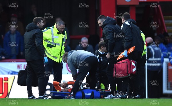 081218 - Brentford v Swansea City - SkyBet Championship - Martin Olsson of Swansea City is treated before being stretchered from the field