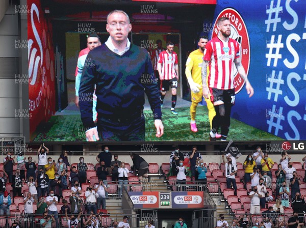 290521 - Brentford v Swansea City - SkyBet Championship Play off Final - Swansea City fans look on as Swansea City Manager Steve Cooper leads out his side