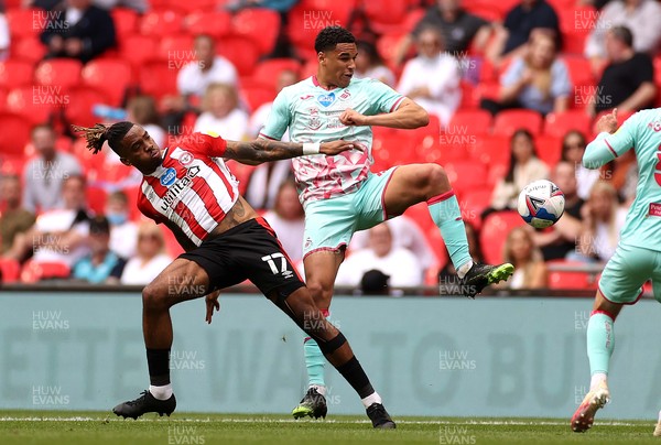 290521 - Brentford v Swansea City - SkyBet Championship Play off Final - Ben Cabango of Swansea City is tackled by Ivan Toney of Brentford