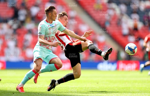 290521 - Brentford v Swansea City - SkyBet Championship Play off Final - Connor Roberts of Swansea City is tackled by Sergi Canos of Brentford