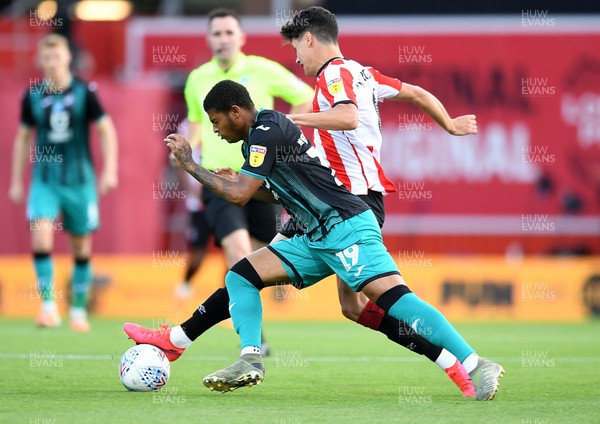 290720 - Brentford v Swansea City - EFL SkyBet Championship Play-Off - Rhian Brewster of Swansea City is tackled by Christian Norgaard of Brentford