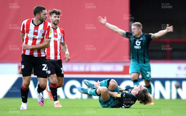 290720 - Brentford v Swansea City - EFL SkyBet Championship Play-Off - Conor Gallagher of Swansea City goes down after challenge by Henrik Dalsgaard of Brentford