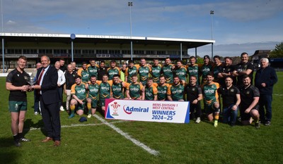 260425 - Bridgend Athletic v Skewen - Admiral National League 1 West Central - Kerry Frey of the WRU presents Bridgend Athletic Captain Jonathan Phillips with the trophy