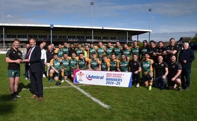 260425 - Bridgend Athletic v Skewen - Admiral National League 1 West Central - Kerry Frey of the WRU presents Bridgend Athletic Captain Jonathan Phillips with the trophy