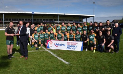 260425 - Bridgend Athletic v Skewen - Admiral National League 1 West Central - Kerry Frey of the WRU presents Bridgend Athletic Captain Jonathan Phillips with the trophy