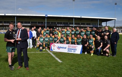 260425 - Bridgend Athletic v Skewen - Admiral National League 1 West Central - Kerry Frey of the WRU presents Bridgend Athletic Captain Jonathan Phillips with the trophy