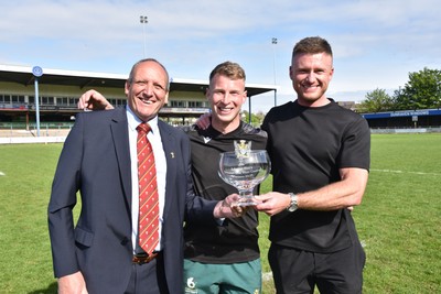 260425 - Bridgend Athletic v Skewen - Admiral National League 1 West Central - Kerry Frey of the WRU presents Bridgend Athletic Captain Jonathan Phillips and sponsor, Harry Griffiths with the trophy