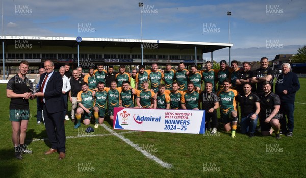 260425 - Bridgend Athletic v Skewen - Admiral National League 1 West Central - Kerry Frey of the WRU presents Bridgend Athletic Captain Jonathan Phillips with the trophy