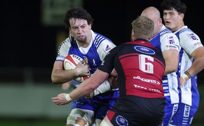 250925 - Bridgend Ravens RFC v Aberavon RFC, Super Rygbi Cymru - Benji Williams of Bridgend takes on Rhys Thomas of Aberavon