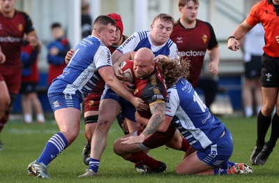 081125 - Bridgend Ravens v RGC - Super Rygbi Cymru - Delwyn Jones of RGC is tackled by Ben Burnell of Bridgend 