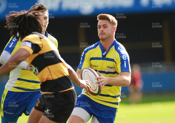 041014 Bridgend Ravens RFC v Newport RFC - Principality Premiership -Ryan Evans of Bridgend takes on Jon Morris of Newport