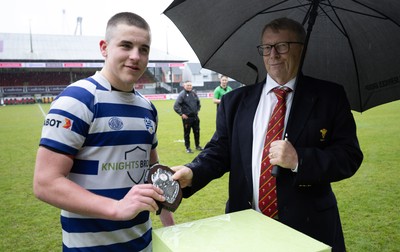 020526 - Bridgend Sports v Lampeter Town, U18s Boys Club Shield Final - Bridgend Sports captain Hari Coulthard  receives the trophy from Chris Jones, WRU Board Member, after winning the  U18s Boys Club Shield Final