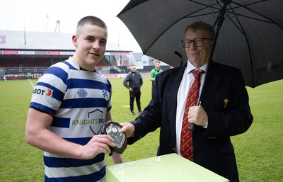 020526 - Bridgend Sports v Lampeter Town, U18s Boys Club Shield Final - Bridgend Sports captain Hari Coulthard  receives the trophy from Chris Jones, WRU Board Member, after winning the  U18s Boys Club Shield Final