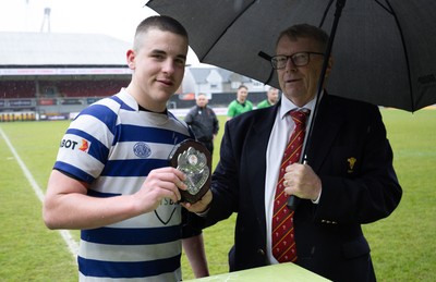 020526 - Bridgend Sports v Lampeter Town, U18s Boys Club Shield Final - Bridgend Sports captain Hari Coulthard  receives the trophy from Chris Jones, WRU Board Member, after winning the  U18s Boys Club Shield Final