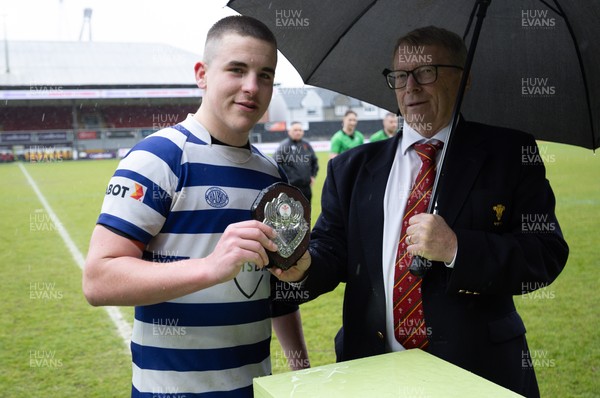 020526 - Bridgend Sports v Lampeter Town, U18s Boys Club Shield Final - Bridgend Sports captain Hari Coulthard  receives the trophy from Chris Jones, WRU Board Member, after winning the  U18s Boys Club Shield Final