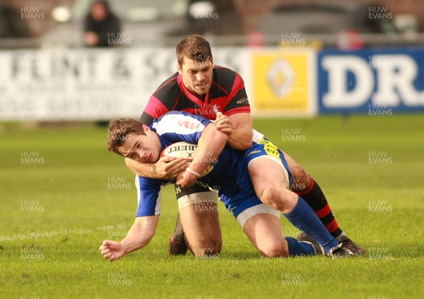 031112 Bridgend RFC v Aberavon RFC - Principality Premiership -Bridgend's Nathan Edwards is tackled by Aberavon's William Price 