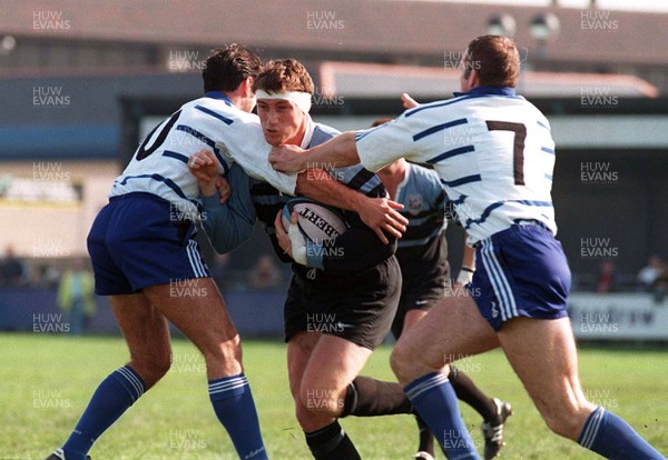 181097 - Bridgend v Cardiff - Steve Williams of Cardiff is tackled by Mathew Lewis and Andrew Williams