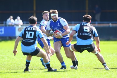 050425 - Bridgend v Cardiff RFC - Super Rygbi Cymru (SRC) - Harry Olding of Bridgend Ravens takes on Harri Wilde (10) and Lucas de la Rua of Cardiff