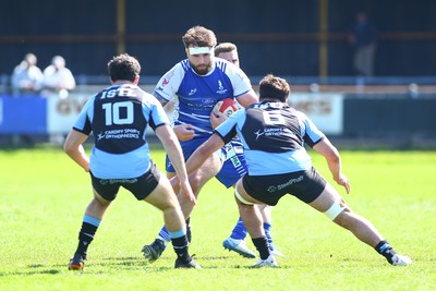 050425 - Bridgend v Cardiff RFC - Super Rygbi Cymru (SRC) - Harry Olding of Bridgend Ravens takes on Harri Wilde (10) and Lucas de la Rua of Cardiff