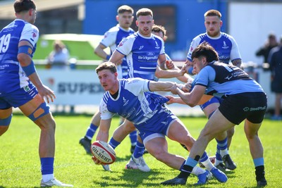 050425 - Bridgend v Cardiff RFC - Super Rygbi Cymru (SRC) - Edd Howley of Bridgend Ravens is tackled by Elijah Evans of Cardiff