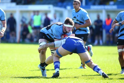 050425 - Bridgend v Cardiff RFC - Super Rygbi Cymru (SRC) - Sean Moore of Cardiff is tackled by Kyle Harris of Bridgend Ravens