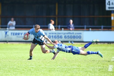 050425 - Bridgend v Cardiff RFC - Super Rygbi Cymru (SRC) - Matty Young of Cardiff brushes off Coum Nott of Bridgend Ravens