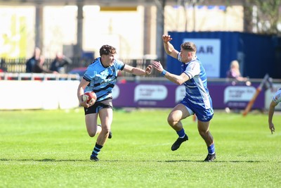 050425 - Bridgend v Cardiff RFC - Super Rygbi Cymru (SRC) - Matty Young of Cardiff is tackled by McCauley Rowley of Bridgend Ravens