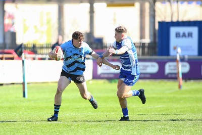 050425 - Bridgend v Cardiff RFC - Super Rygbi Cymru (SRC) - Matty Young of Cardiff is tackled by McCauley Rowley of Bridgend Ravens