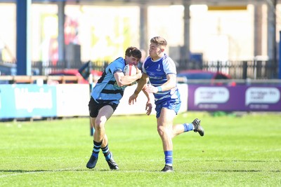 050425 - Bridgend v Cardiff RFC - Super Rygbi Cymru (SRC) - Matty Young of Cardiff is tackled by McCauley Rowley of Bridgend Ravens