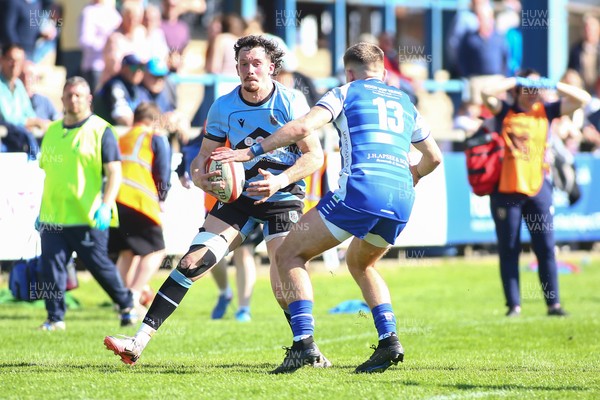 050425 - Bridgend v Cardiff RFC - Super Rygbi Cymru (SRC) - Joe Goodchild of Cardiff takes on McCauley Rowley of Bridgend Ravens