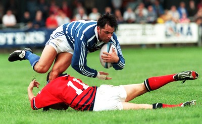 230897 - Bridgend v Llanelli - Gwilwym Wilkins is tackled by Aled Thomas