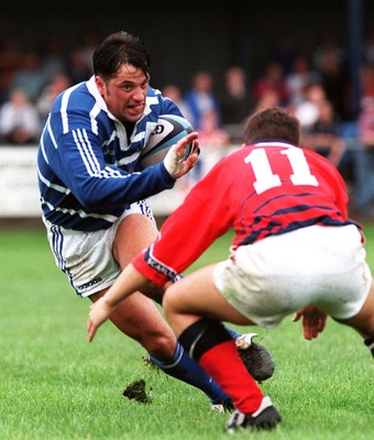 230897 - Bridgend v Llanelli - Gwilwym Wilkins is tackled by Aled Thomas