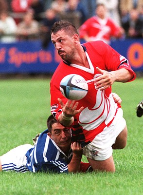 230897 - Bridgend v Llanelli - Paul Morris is tackled by Karl Hammans