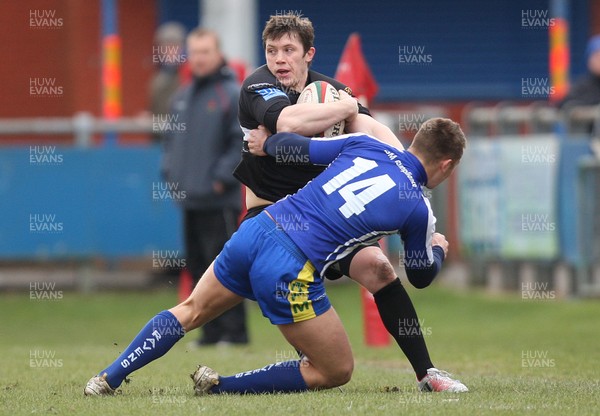 230213 - Bridgend v Neath, Principality Premiership - Neath's David Langdon takes on Bridgend's Rhys Ward Jones