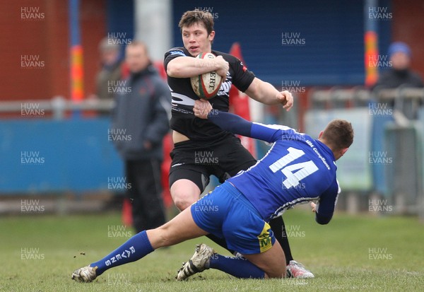 230213 - Bridgend v Neath, Principality Premiership - Neath's David Langdon takes on Bridgend's Rhys Ward Jones