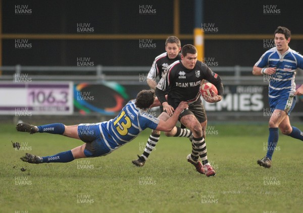 14.01.12 Bridgend RFC v Pontypridd RFC - Principality Premiership - Pontypridd's Gary Williams is tackled by Bridgend's Jamie Murphy 