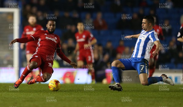 240117 - Brighton & Hove Albion v Cardiff City - SkyBet Championship - Junior Hoilett of Cardiff City is tackled by Beram Kayal of Brighton