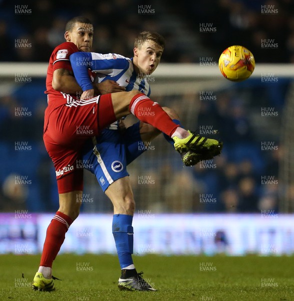 240117 - Brighton & Hove Albion v Cardiff City - SkyBet Championship - Solly March of Brighton is challenged by Lee Peltier of Cardiff City