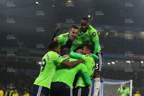 160419 - Brighton and Hove Albion v Cardiff City - Premier League - Goalscorer Sean Morrison is mobbed by his team mates after scoring