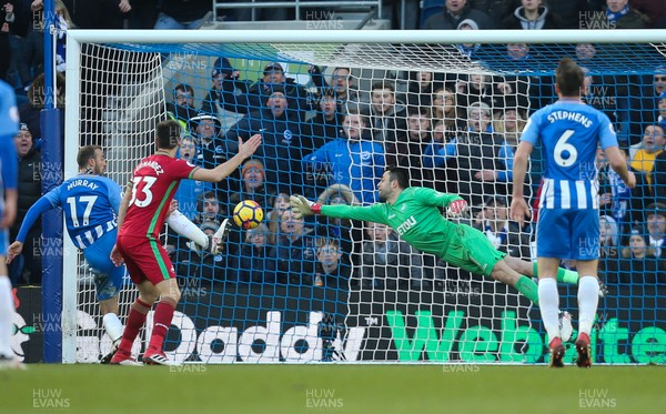 240218 - Brighton and Hove Albion v Swansea City, Premier League - Swansea City goalkeeper Lukasz Fabianski dives to save on the line from Glenn Murray of Brighton