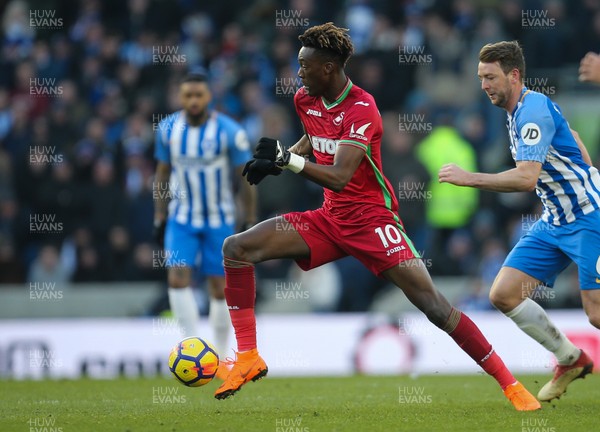 240218 - Brighton and Hove Albion v Swansea City, Premier League - Tammy Abraham of Swansea City gets away from Dale Stephens of Brighton