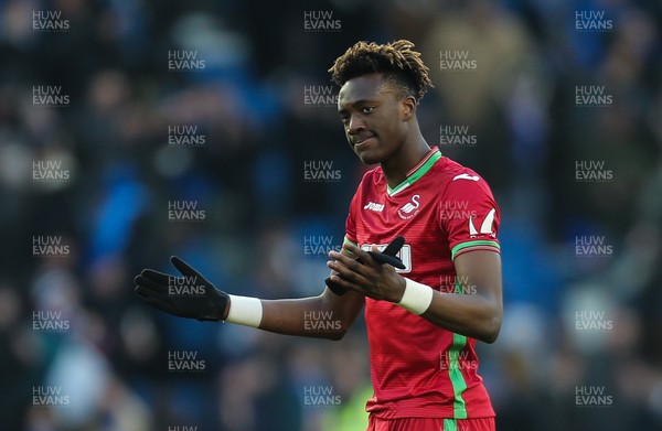 240218 - Brighton and Hove Albion v Swansea City, Premier League - Tammy Abraham of Swansea City shrugs his shoulders as he applauds the fans at the end of the match