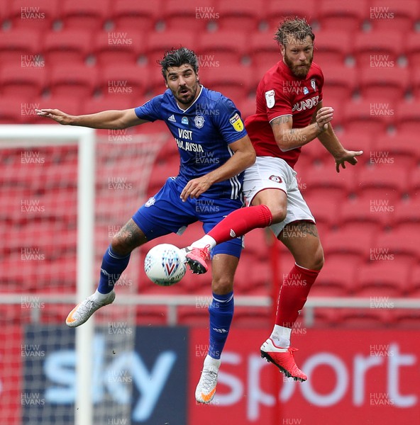 040720 - Bristol City v Cardiff City - SkyBet Championship - Callum Paterson of Cardiff City and Nathan Baker of Bristol City go for the ball