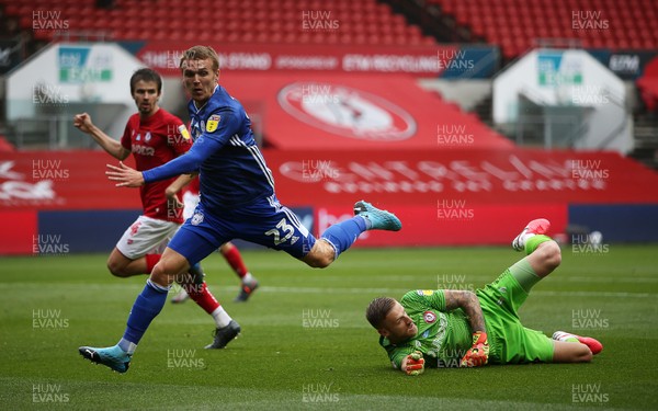040720 - Bristol City v Cardiff City - SkyBet Championship - Goal scorer Danny Ward of Cardiff City tangles with keeper Daniel Bentley of Bristol City