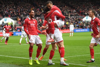 221125 - Bristol City v Swansea City - Sky Bet Championship - Rob Dickie of Bristol City celebrates scoring a goal with team mates