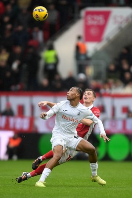 221125 - Bristol City v Swansea City - Sky Bet Championship - Ishe Samuels-Smith of Swansea City is challenged by Scott Twine of Bristol City