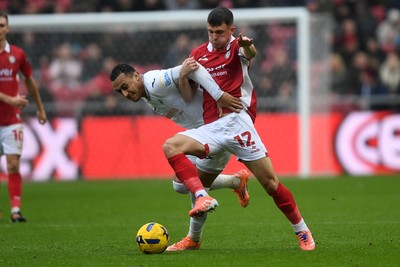 221125 - Bristol City v Swansea City - Sky Bet Championship - Jason Knight of Bristol City is challenged by Adam Idah of Swansea City