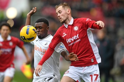 221125 - Bristol City v Swansea City - Sky Bet Championship - Zeidane Inoussa of Swansea City is challenged by Mark Sykes of Bristol City