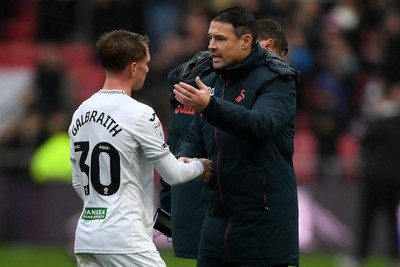 221125 - Bristol City v Swansea City - Sky Bet Championship - Ethan Galbraith of Swansea City with Darren O'Dea, Swansea Caretaker Manager at full time